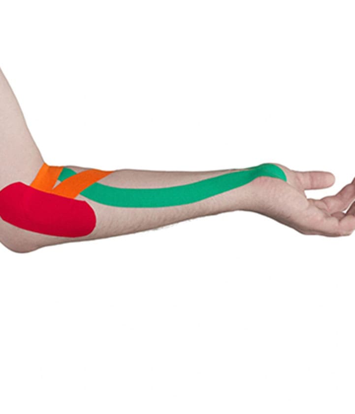 A person with their arm in the air and some kinesio tape on it